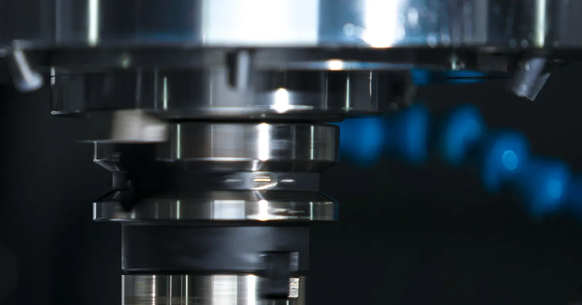 Face mill cutter and tool holder in a CNC machine spindle, shown for 3+2 machining on a tilted work plane